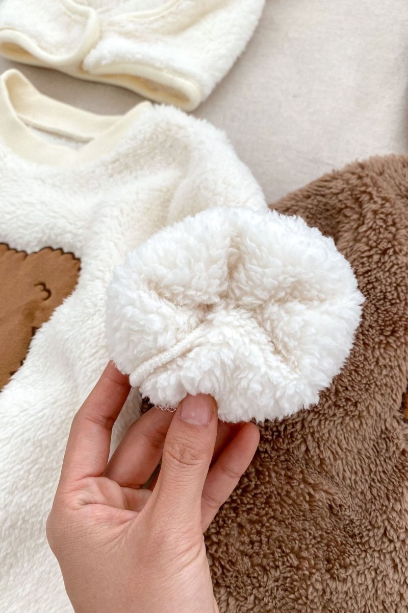 Close-up showing the soft plush fabric of the Love Fur Bear Knitted Hooded Pramsuit