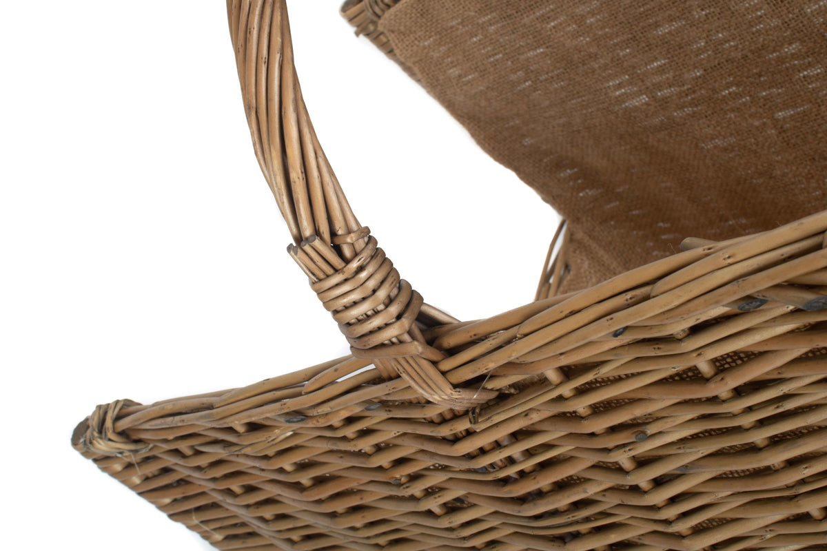 Antique wash willow open end log basket close-up showing the natural willow weave, hessian lining and basket construction