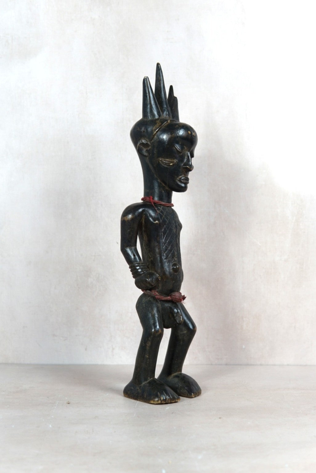 Baule carved figure sculpture 118.1 viewed from the opposite side showing the hand-carved form and aged finish