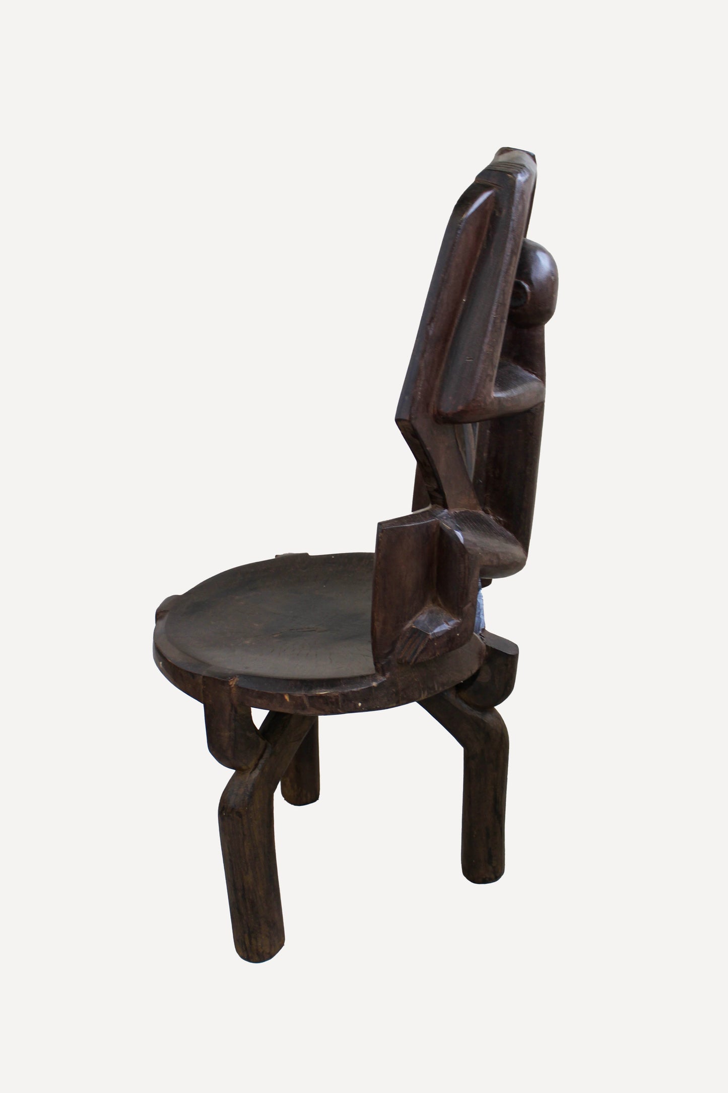 Hand-carved Makonde chair from Tanzania 242.4 in side view showing its upright sculptural profile