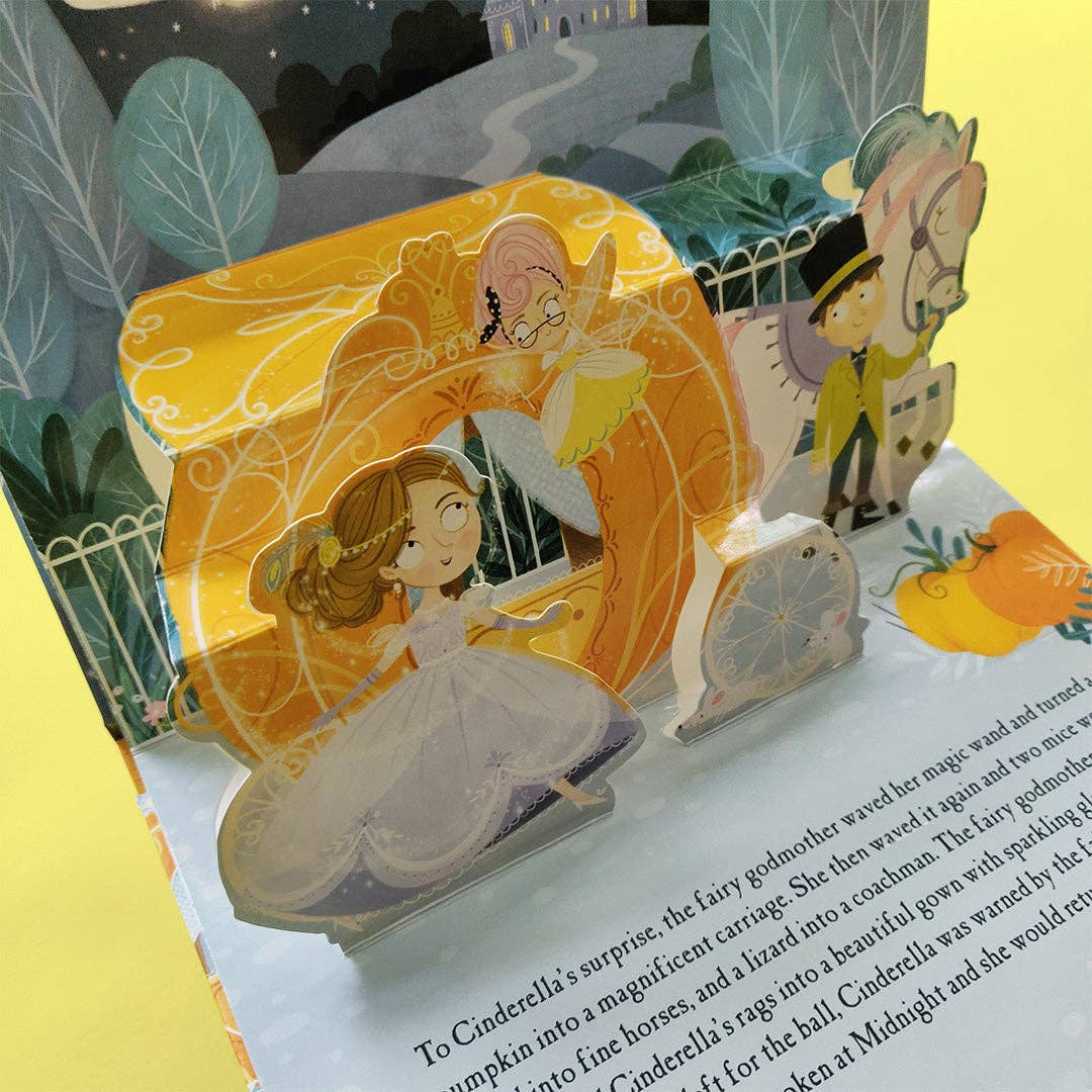 Cinderella children's pop-up book showing a close-up of its layered three-dimensional illustrations and story text