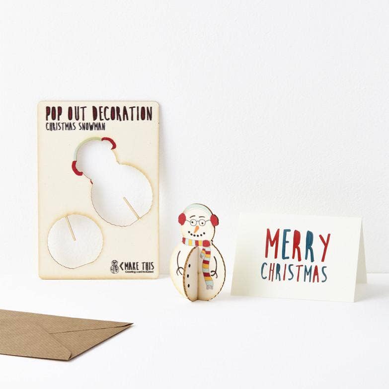 Pop Out Standing Snowman Christmas Card showing the pop-out sheet, assembled wooden snowman, greeting card and brown envelope