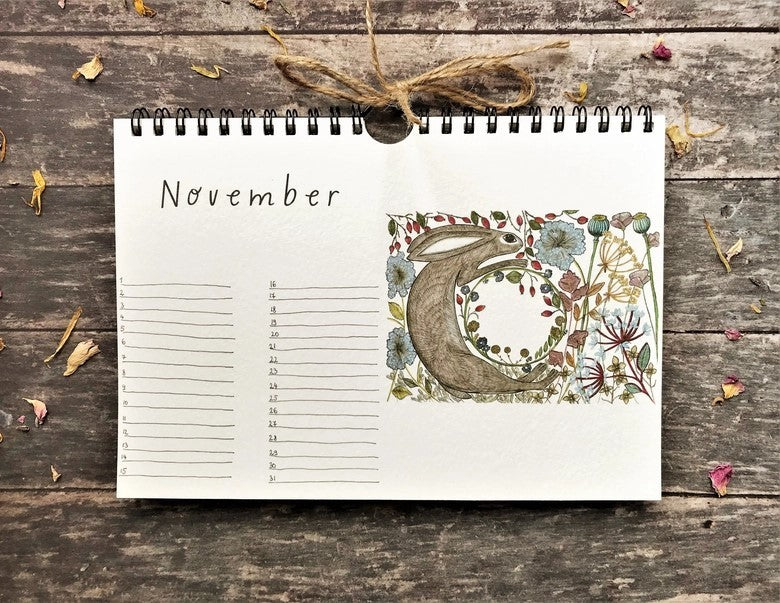 Wildlife & Botanical Perpetual Calendar November page featuring a running hare surrounded by flowers and autumn berries