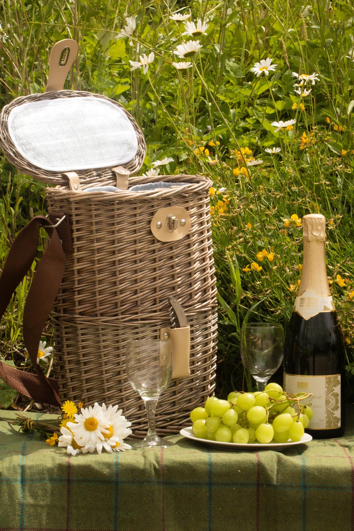 2 Bottle Chilled Carry Basket with open insulated lid on a rustic table in an English countryside setting