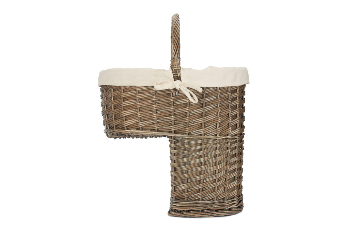 Side view of antique wash willow stair basket showing its stepped shape designed to sit on stairs