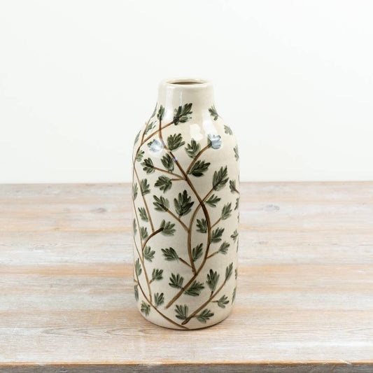 Cream ceramic foliage vase with trailing green leaves and brown stems, 30.5cm high
