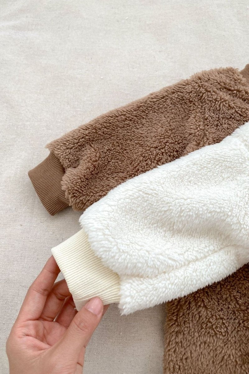 Close-up of the soft Brown fabric on the Love Fur Bear Knitted Hooded Pramsuit