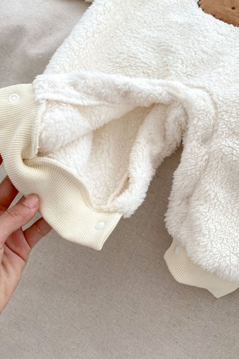 Close-up of the soft Creme fabric on the Love Fur Bear Knitted Hooded Pramsuit