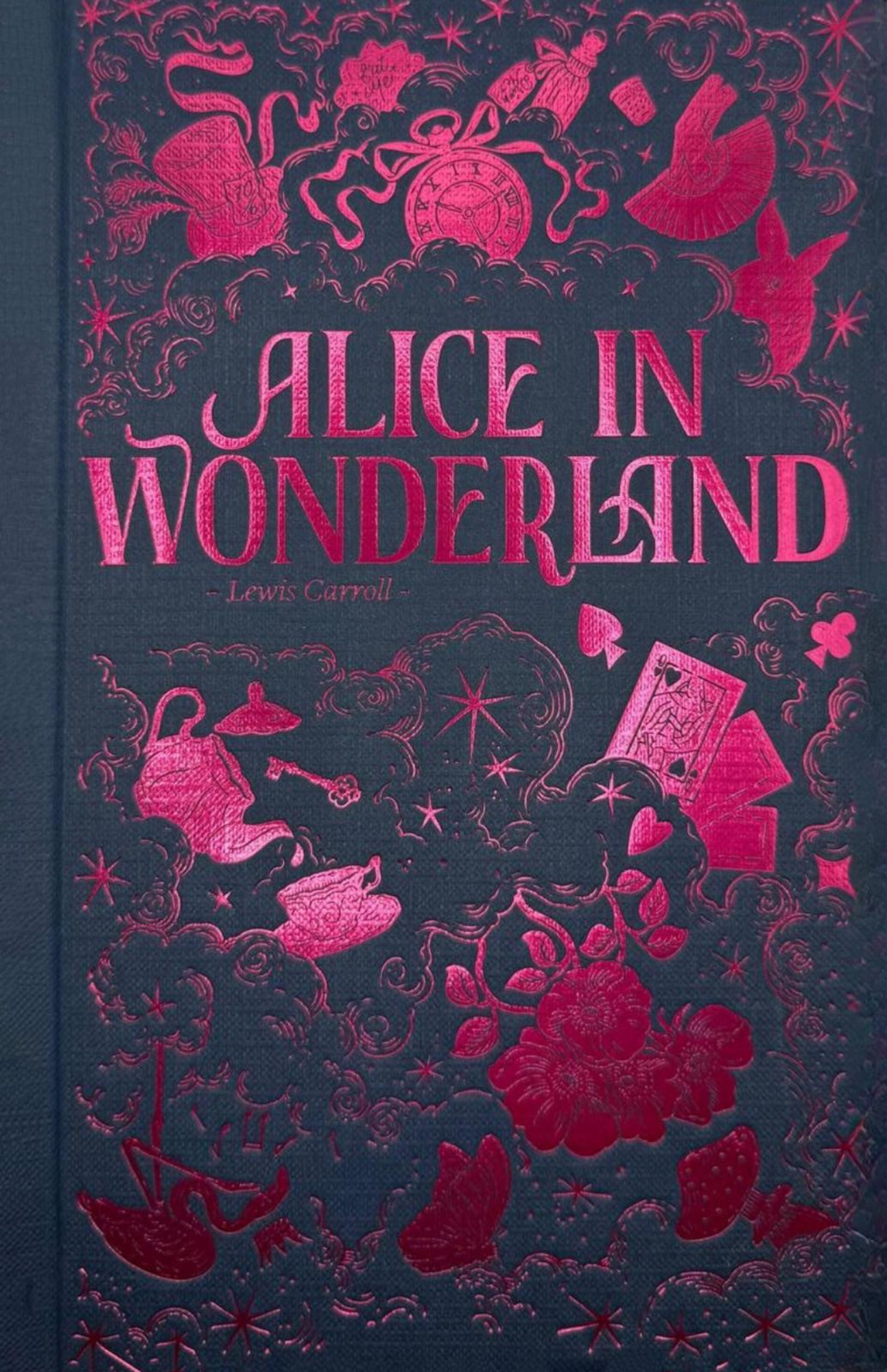 Front cover of the Alice in Wonderland Wordsworth Luxe Collection hardback by Lewis Carroll with decorative foil detailing.