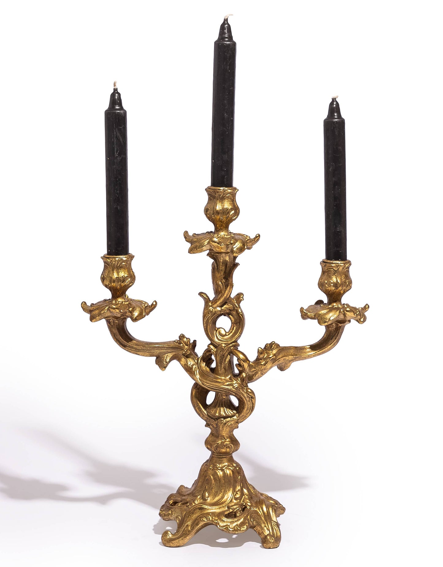 Antique Gold Ornate Candelabra displayed with three dark taper candles
