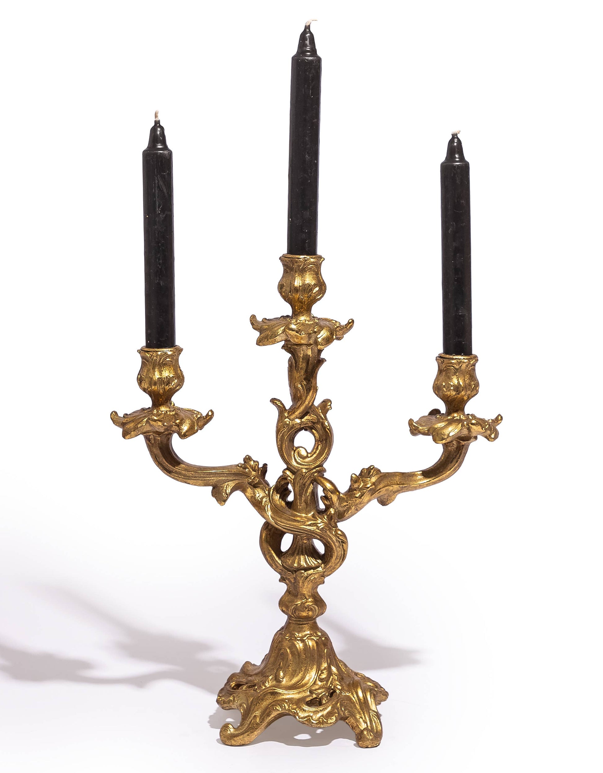 Antique Gold Ornate Candelabra displayed with three dark taper candles