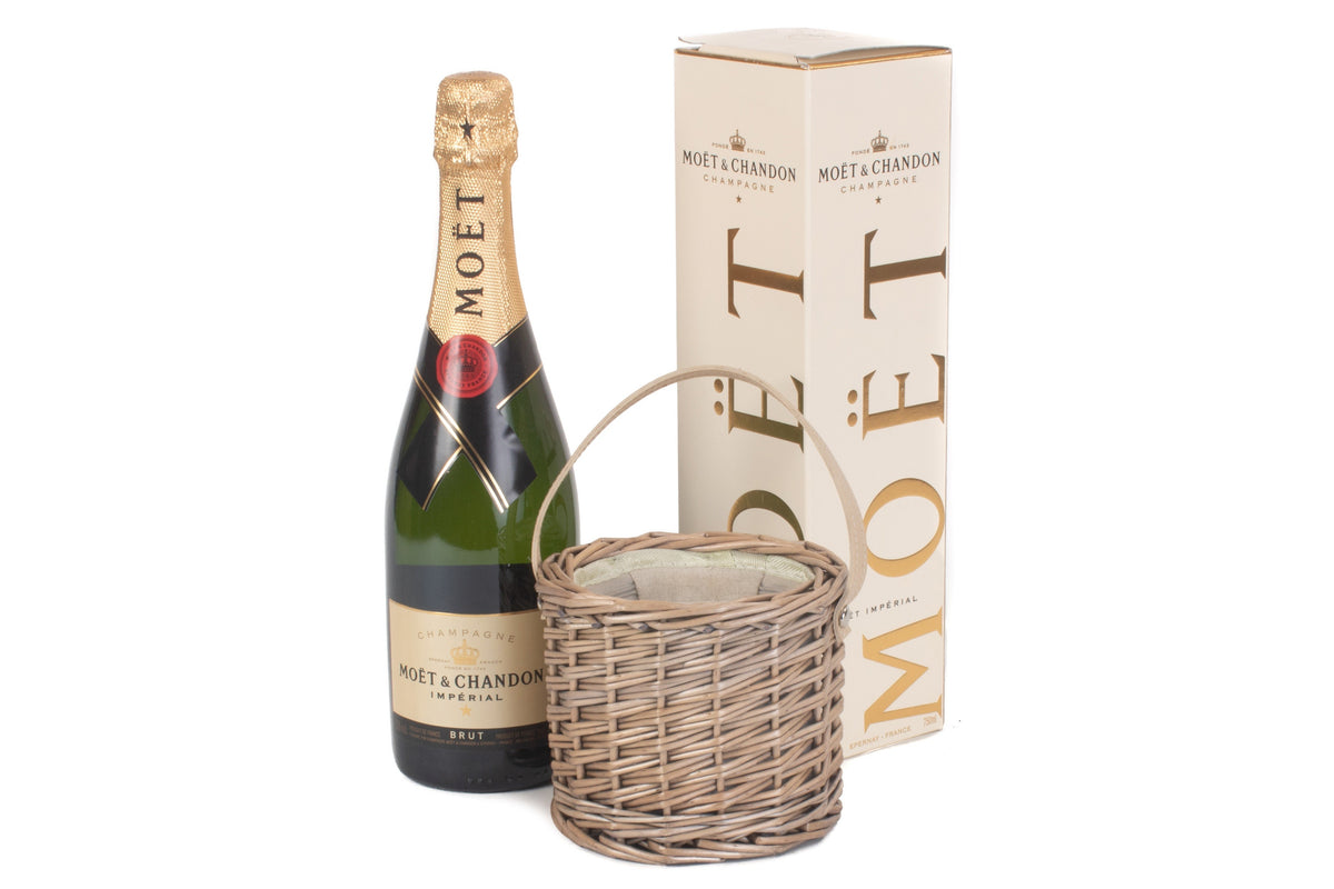 Antique Wash Willow Mini Ice Basket displayed beside a champagne bottle and gift box to show its compact size
