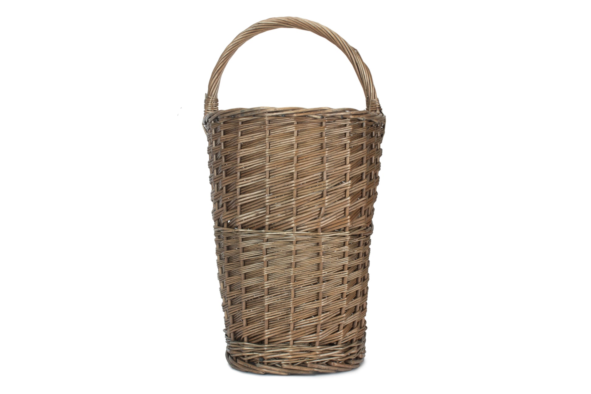 Front view of the antique wash willow stair basket with integrated carry handle.