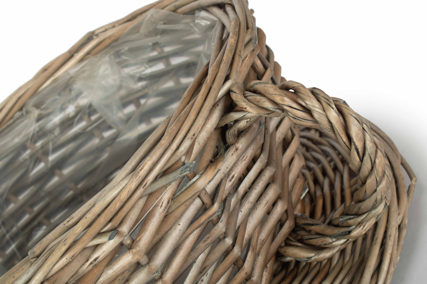 Antique Wash Willow Tea Cup Planter Basket close-up showing the natural woven willow, twisted handle and plastic lining