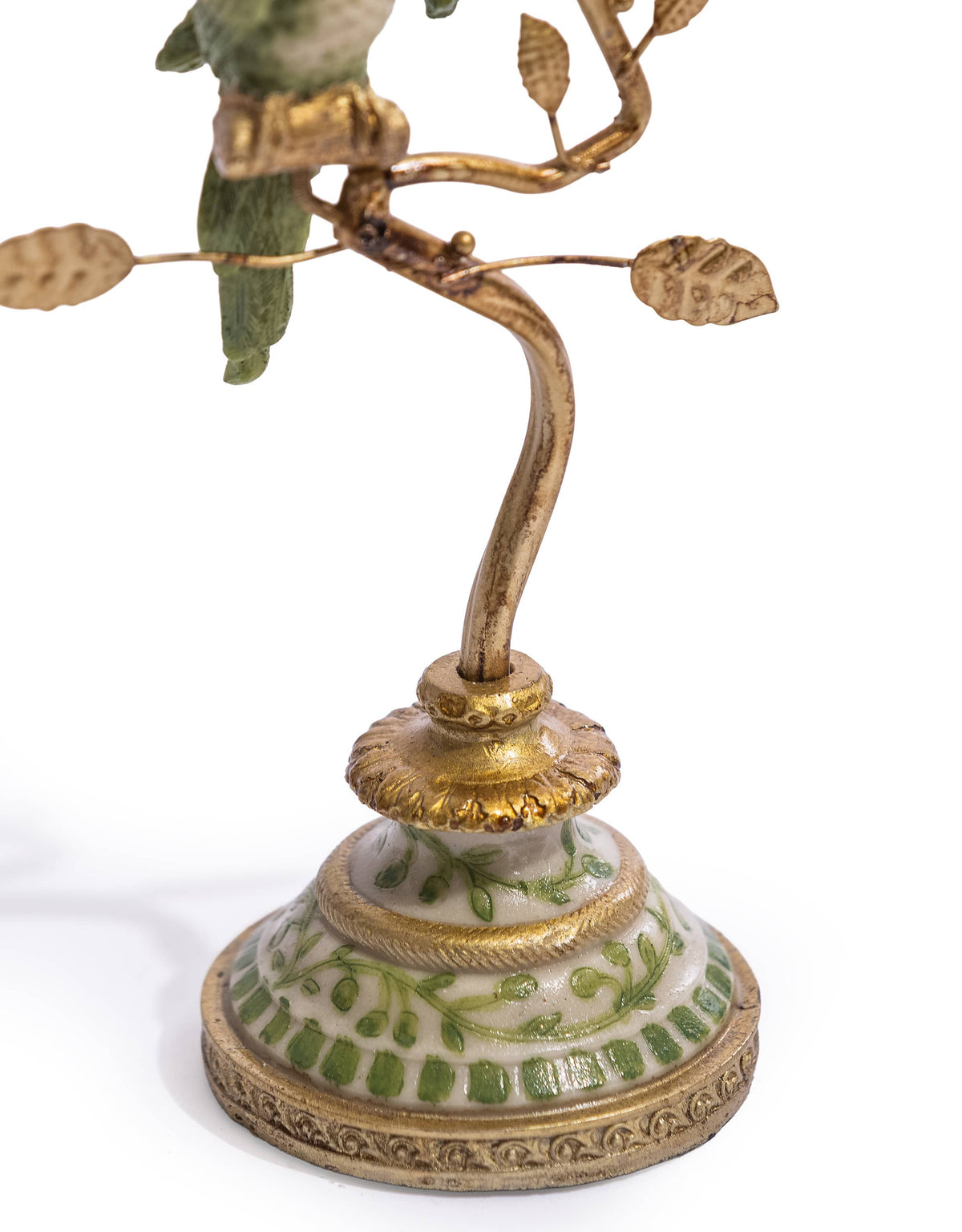 Decorative green and white base of the antiqued gold parrot candle holder