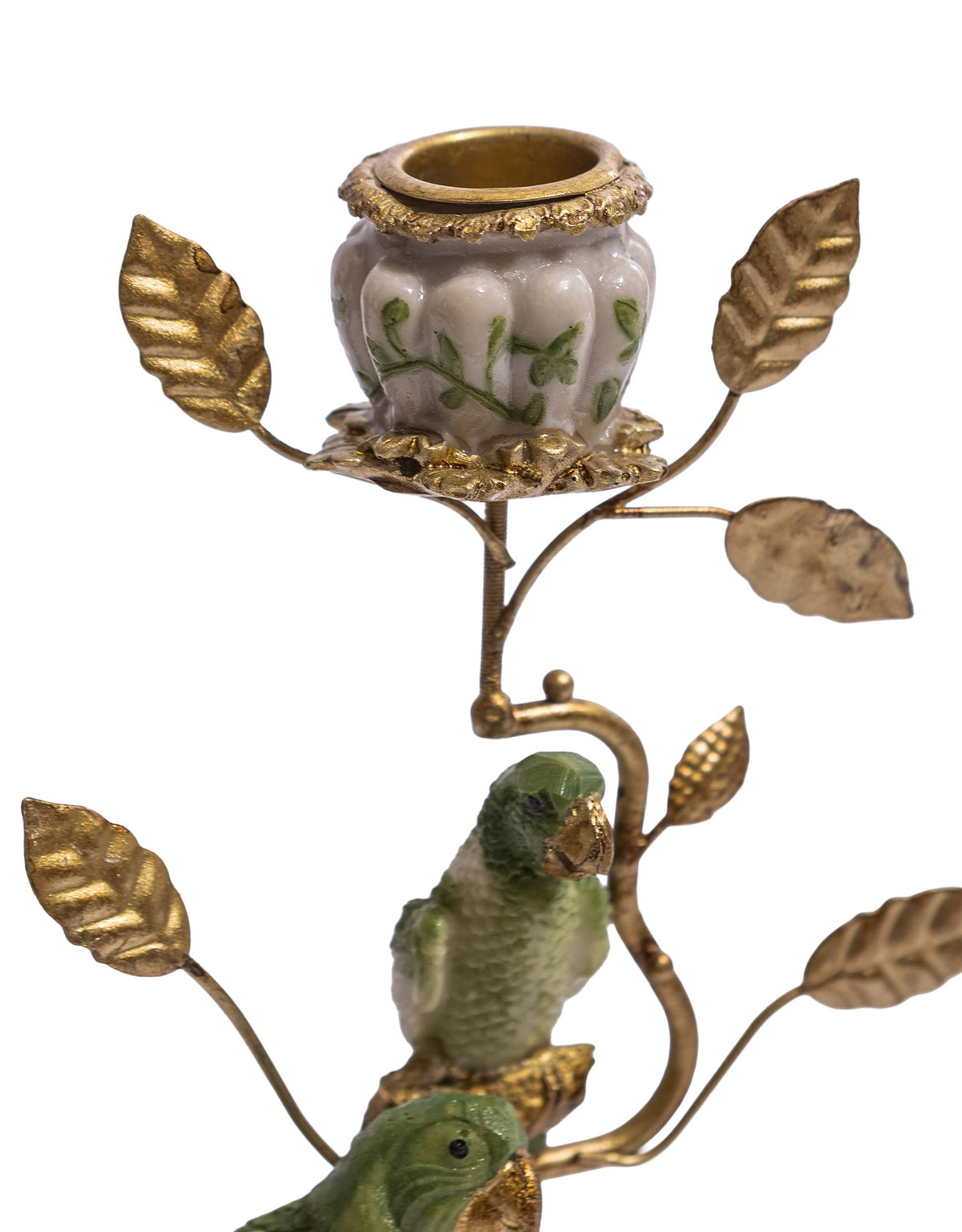 Close view of the green parrots, antiqued gold leaves and decorative candle cup