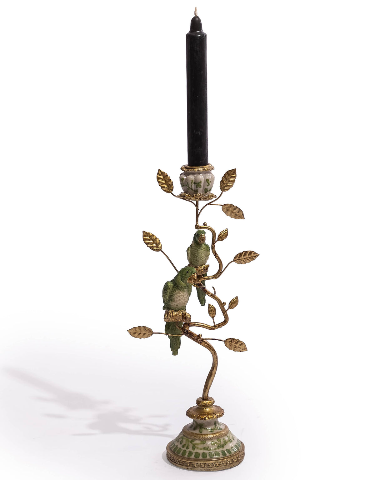 Green and gold parrot candle holder displayed with a tall black taper candle