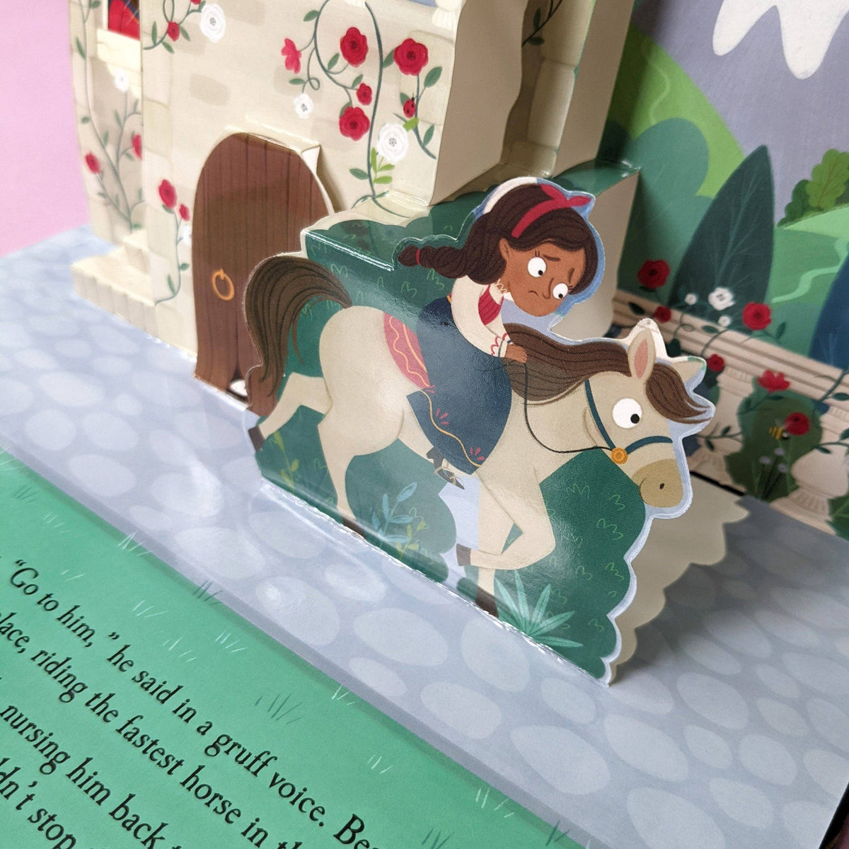 Beauty and the Beast pop-up book showing colourful three-dimensional illustrations and printed story text
