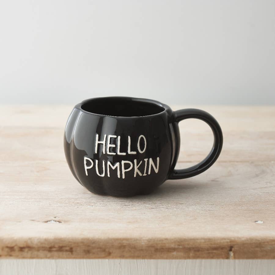 Black ceramic pumpkin-shaped mug embossed with Hello Pumpkin