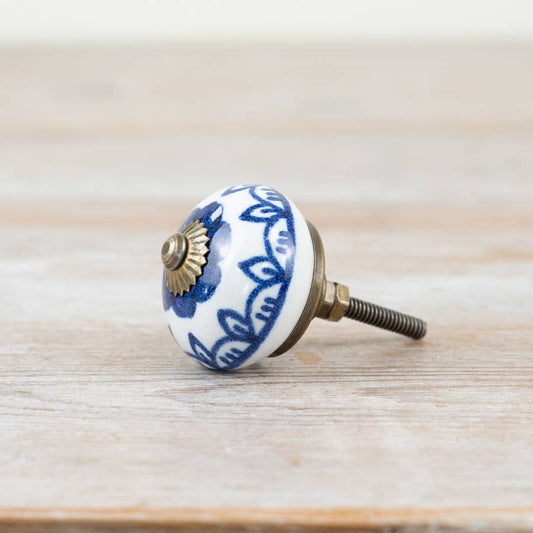 Blue and white ceramic door knob with antique bronze-coloured fitting