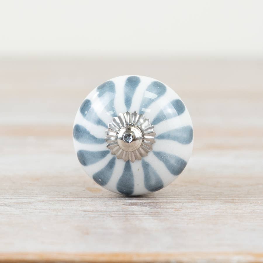 Front view of blue and white striped ceramic door knob
