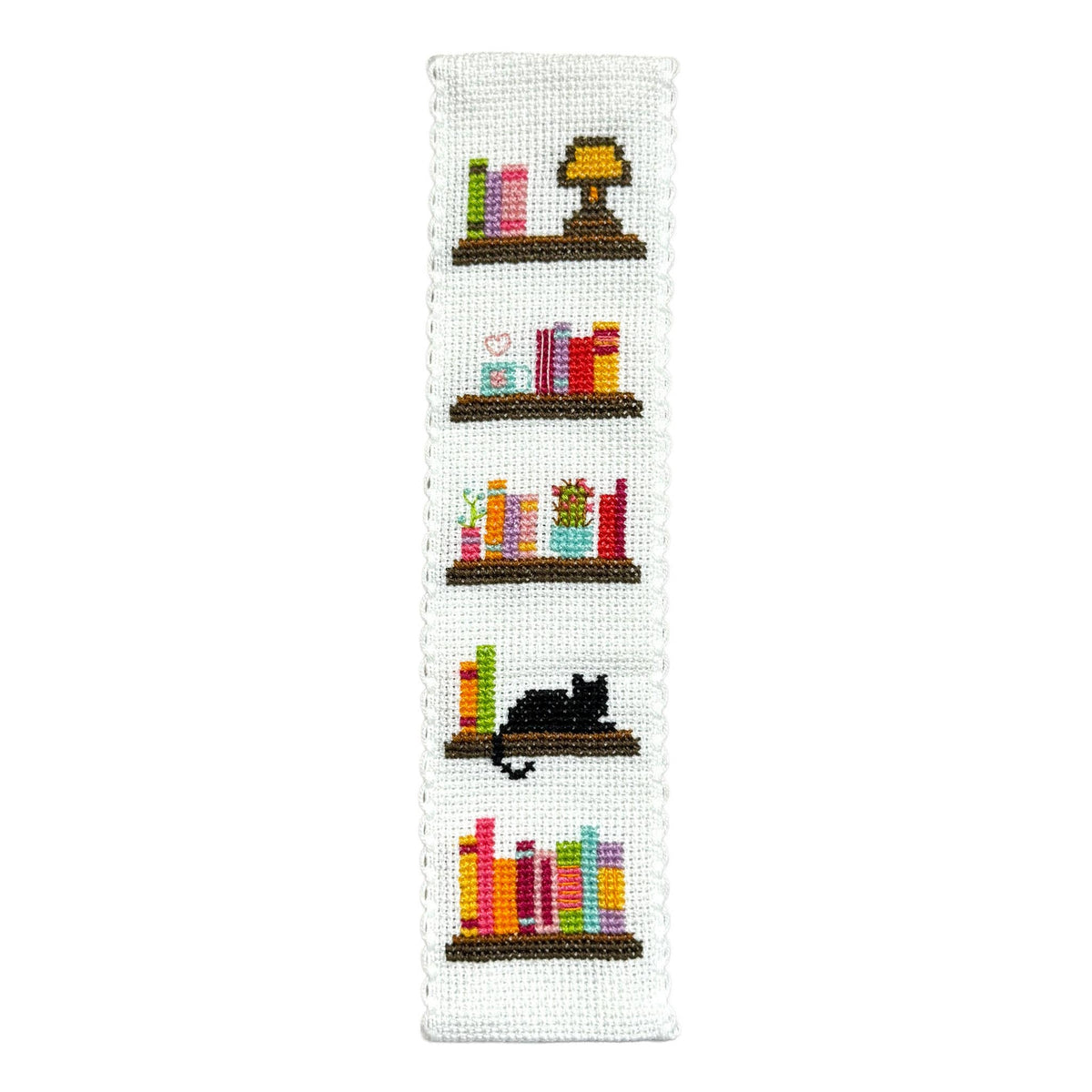 Book Lover Cross Stitch Bookmark Kit finished bookshelf design with colourful books, cosy details and a sleeping black cat