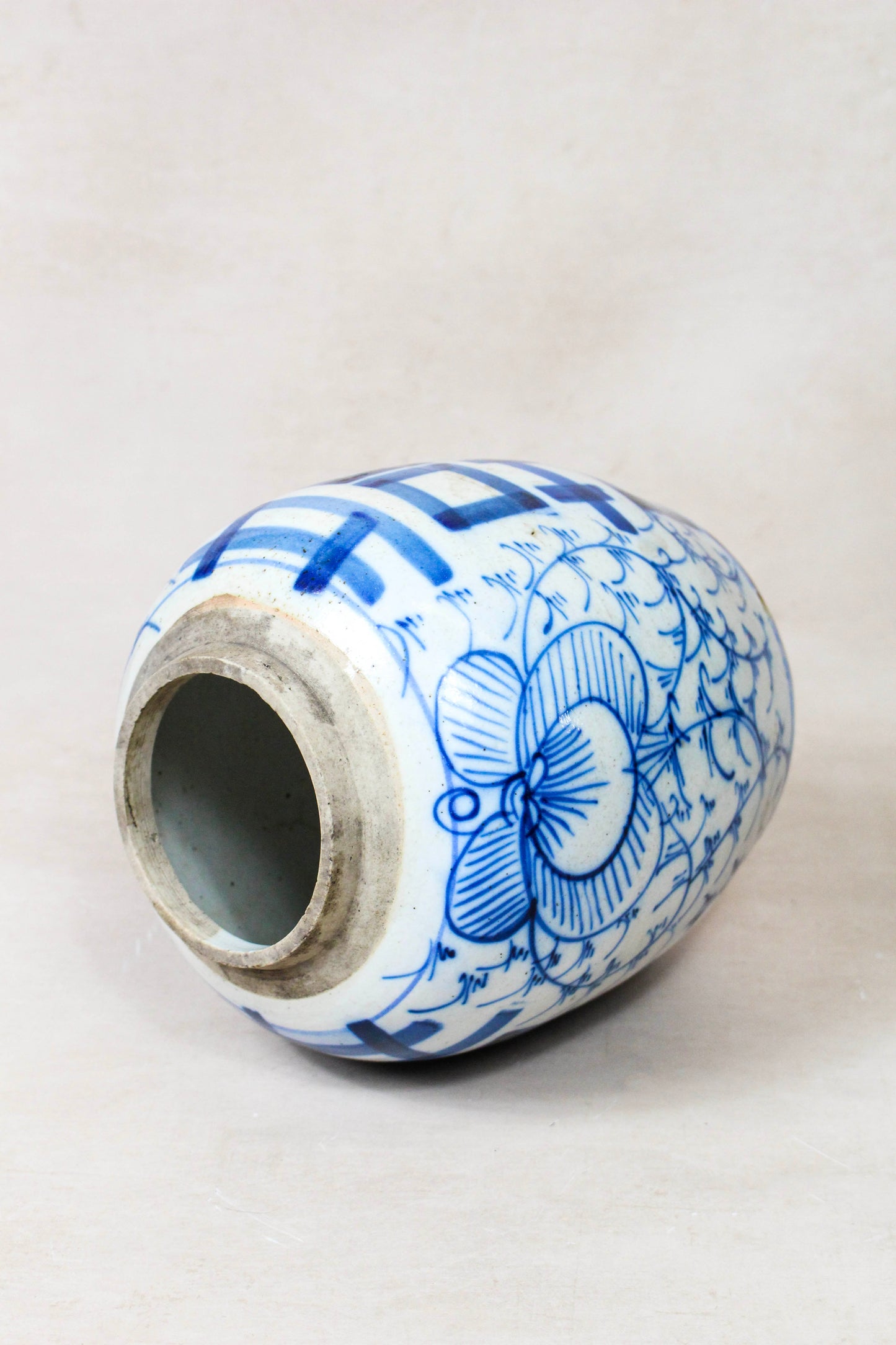 Antique Chinese blue and white porcelain jar viewed from above showing the opening and aged glaze
