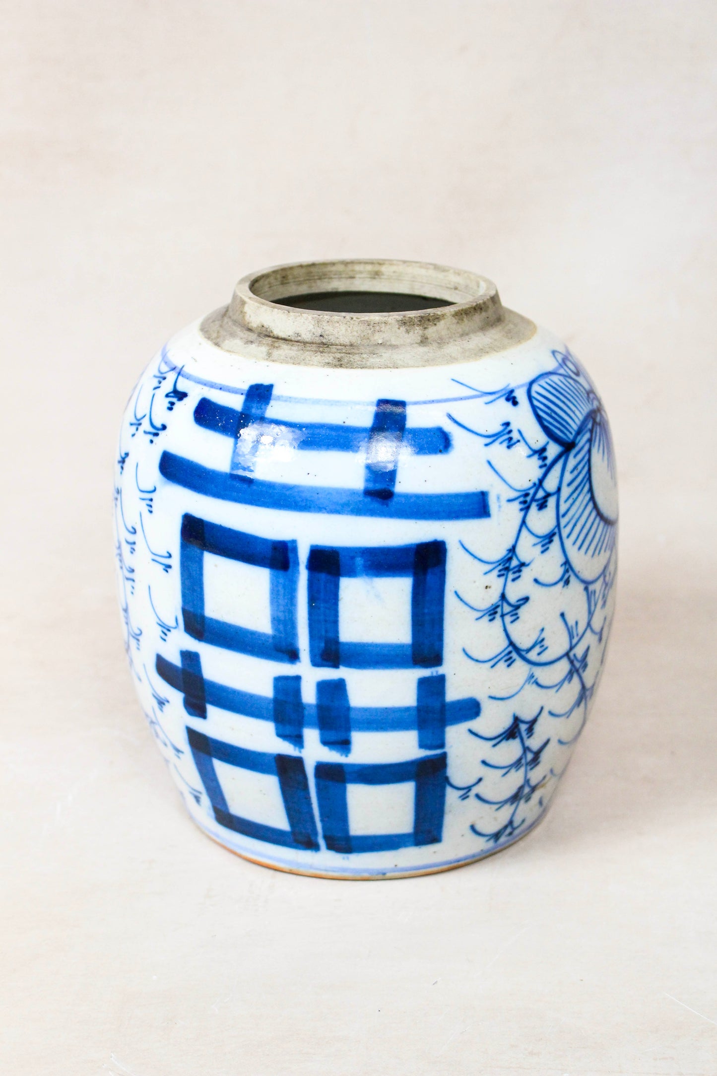 Antique Chinese blue and white porcelain jar showing the blue geometric decoration on the reverse
