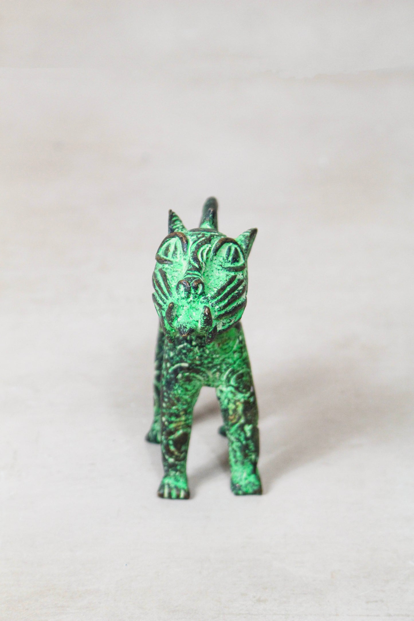 Benin bronze leopard sculpture 56.24 viewed from the rear showing its aged bronze surface and sculptural form