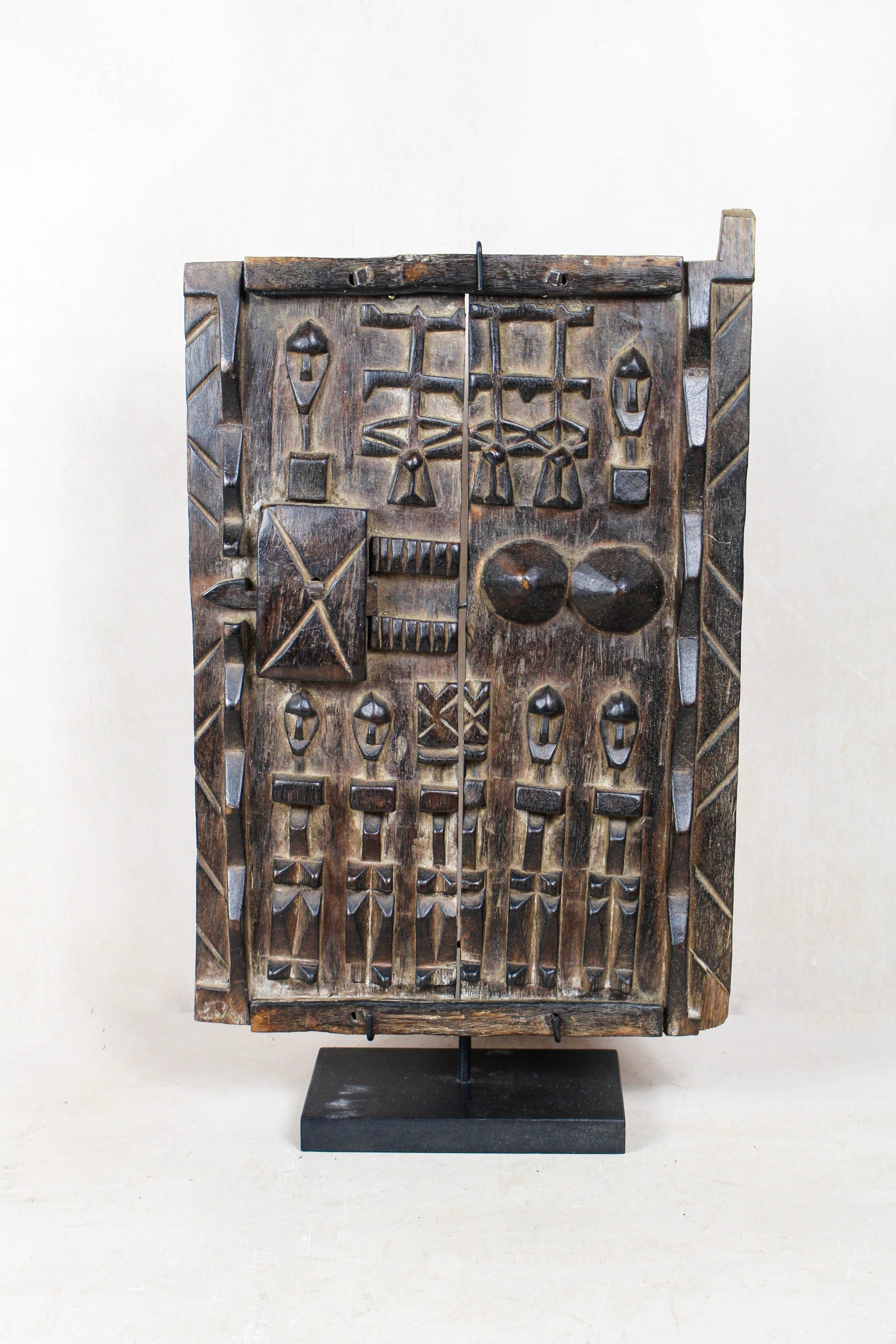 Dogon granary door from Mali 38.2 with richly carved symbolic figures and traditional detailing
