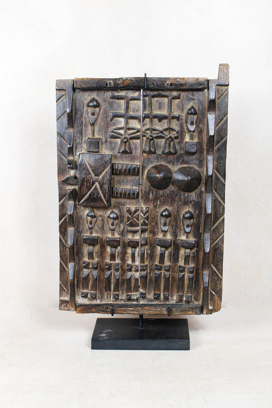 Dogon granary door from Mali 38.2 with richly carved symbolic figures and traditional detailing

