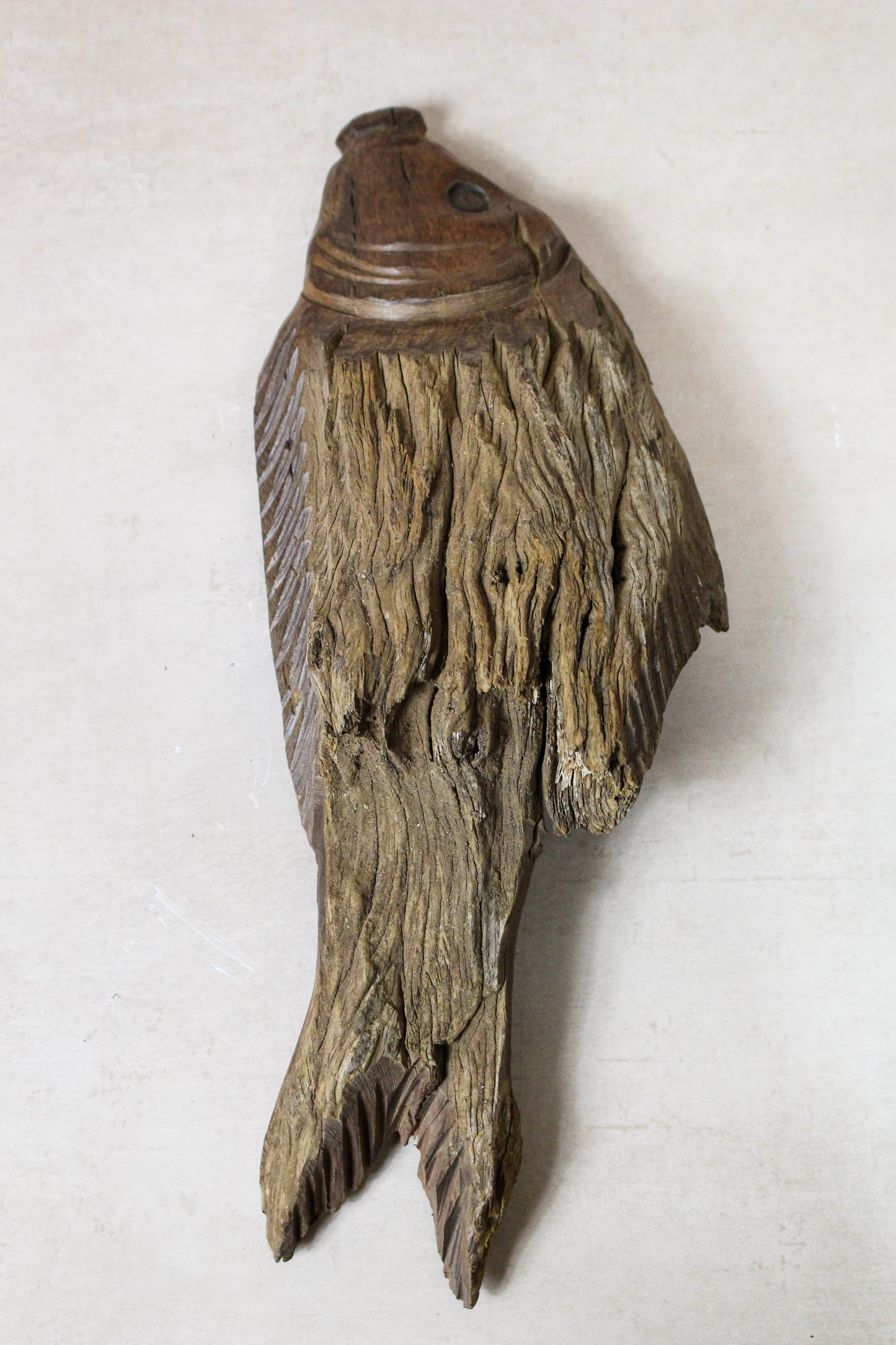 Hand-carved driftwood fish wall art 116.12 showing the textured reclaimed wood and individual markings
