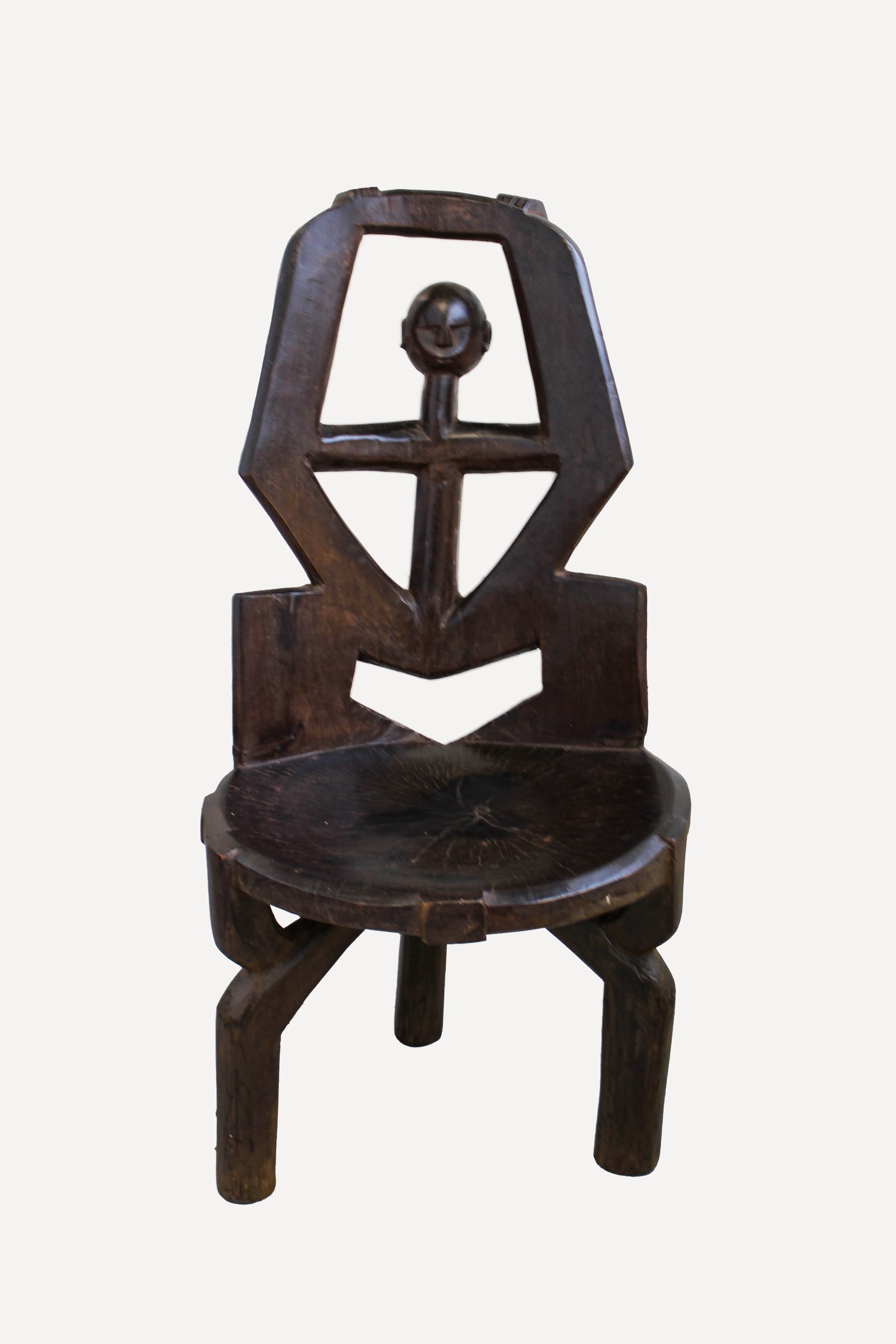 Hand-carved Makonde chair from Tanzania 242.4 showing the open backrest, carved hands and ancestor figure
