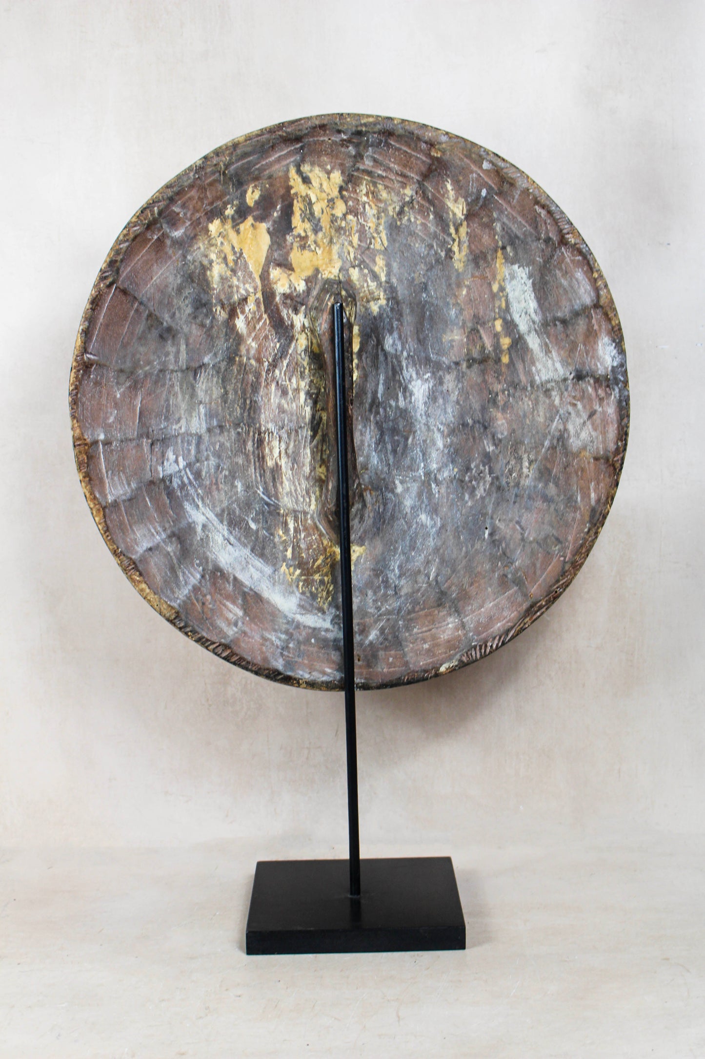 Round Cameroon shield 161.3 viewed from the rear showing its handmade construction and display stand