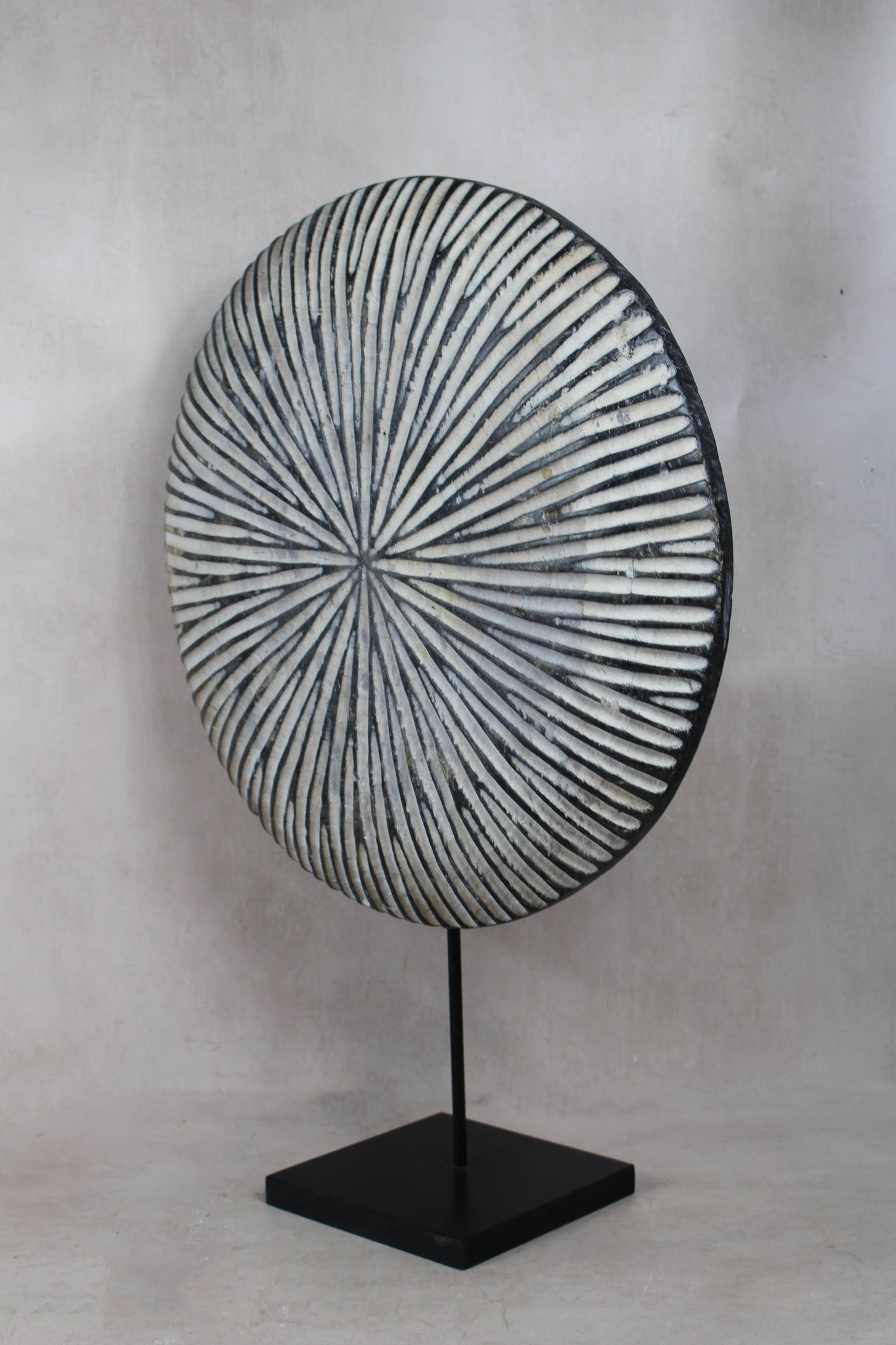 Round Cameroon shield 161.3 shown from an alternative angle highlighting its patterned surface and depth
