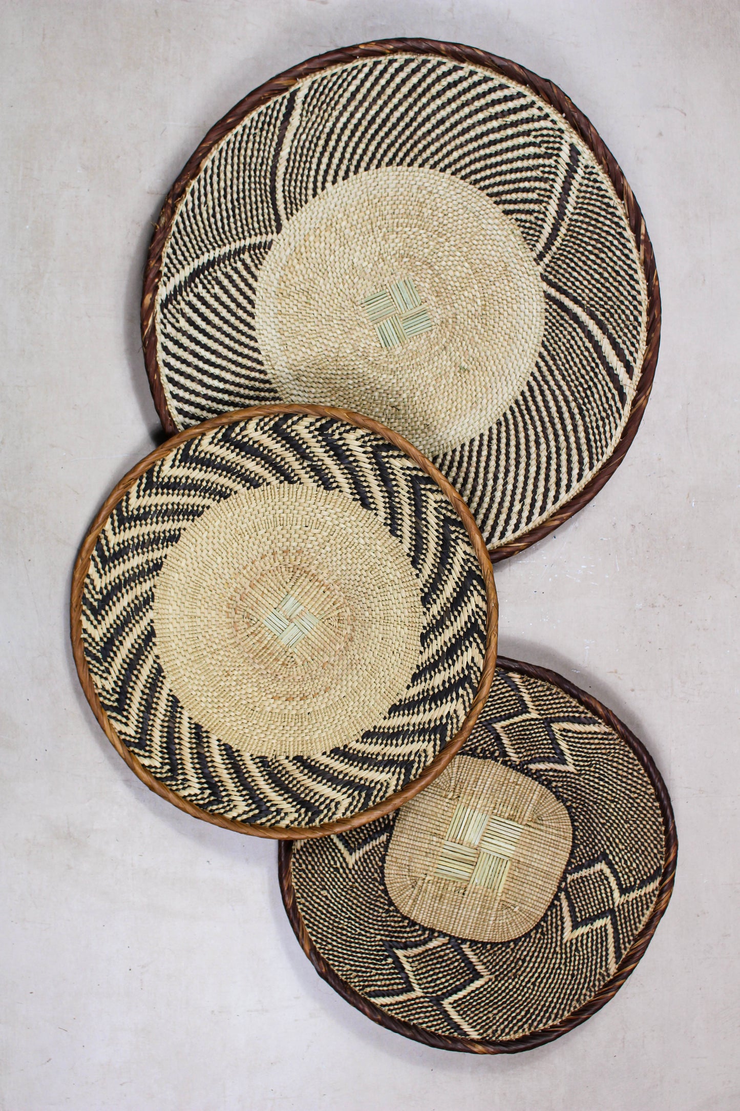 Set of three handwoven Tonga wall baskets No. 27 in naturally dyed Ilala palm
