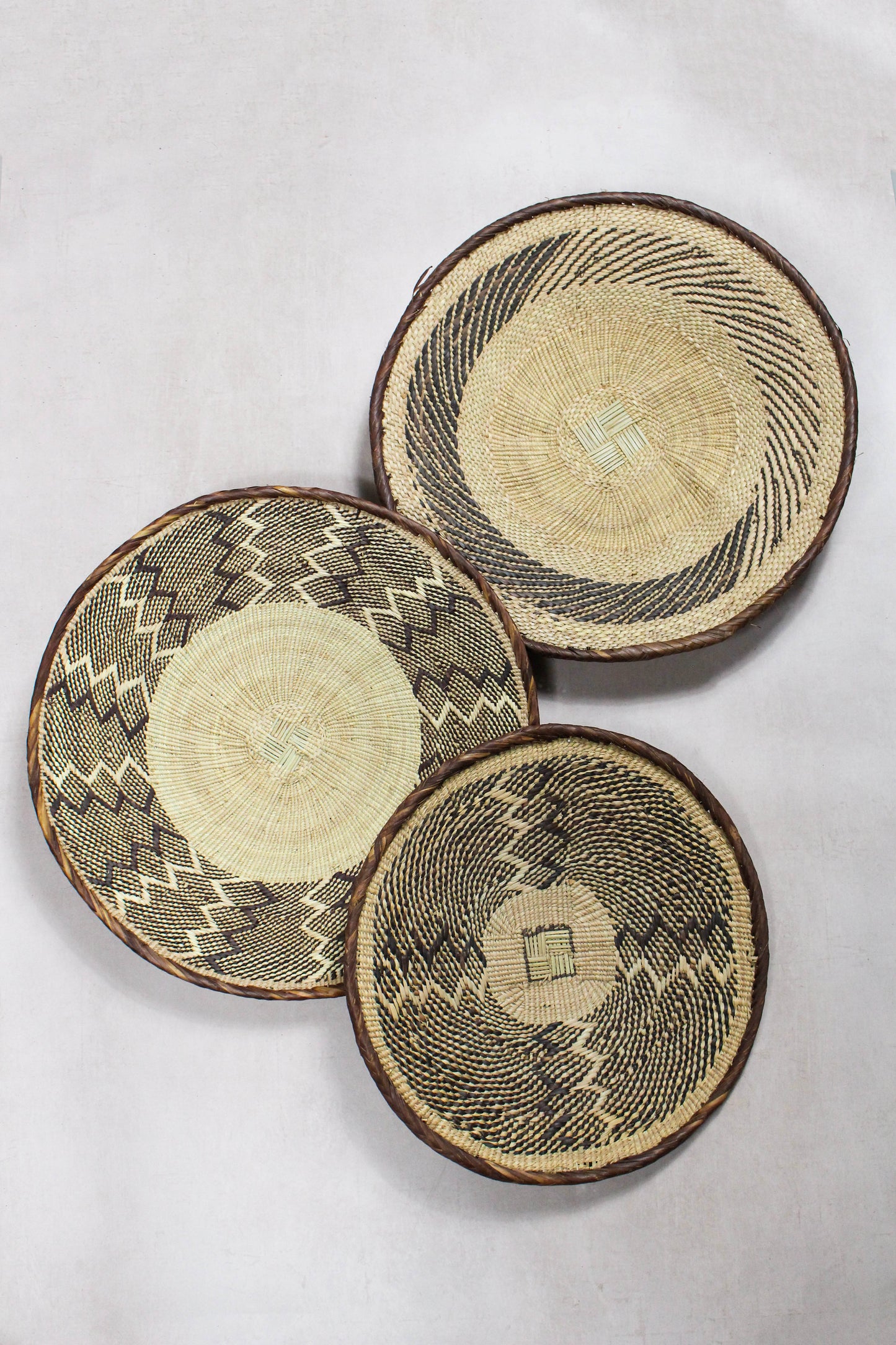 Set of three handwoven Tonga wall baskets No. 59 in naturally dyed Ilala palm
