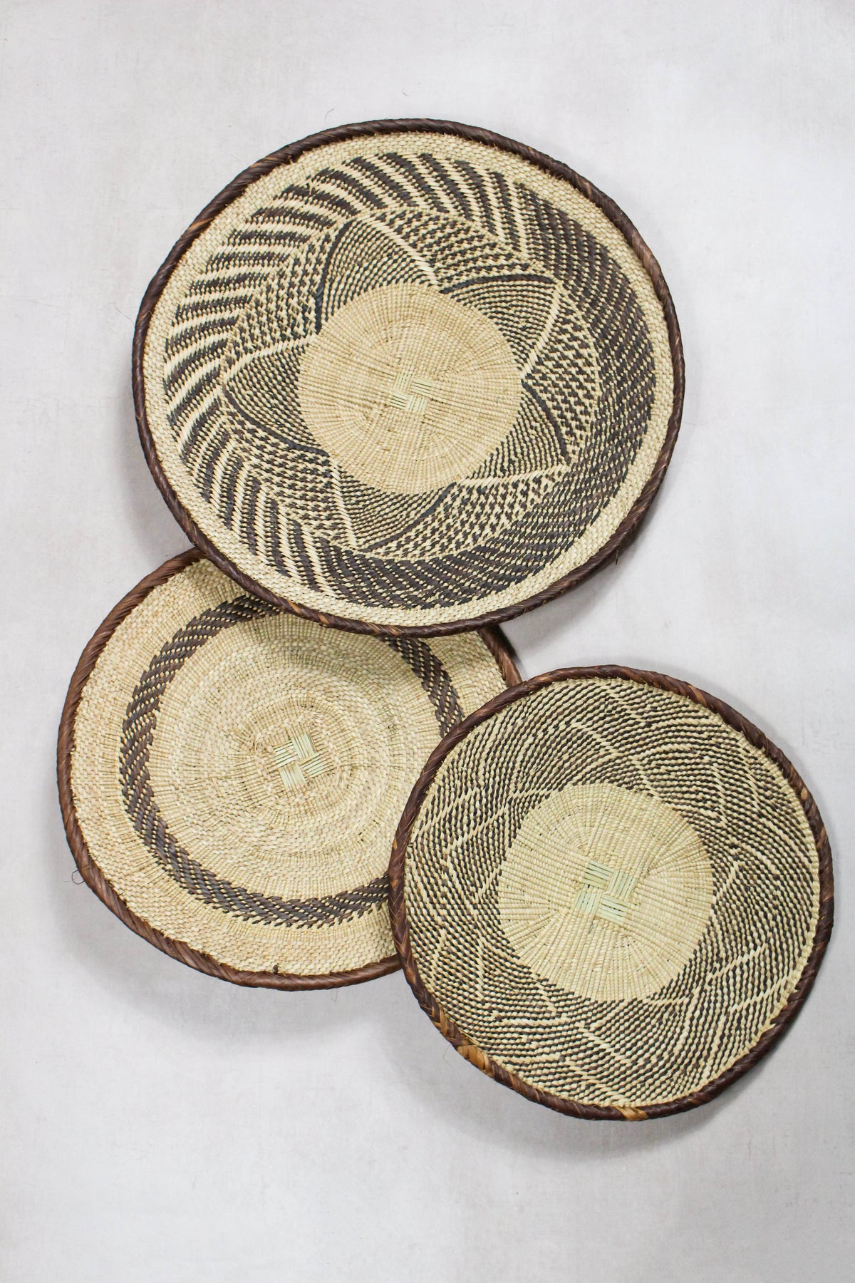 Set of three handwoven Tonga wall baskets No. 67 in naturally dyed Ilala palm
