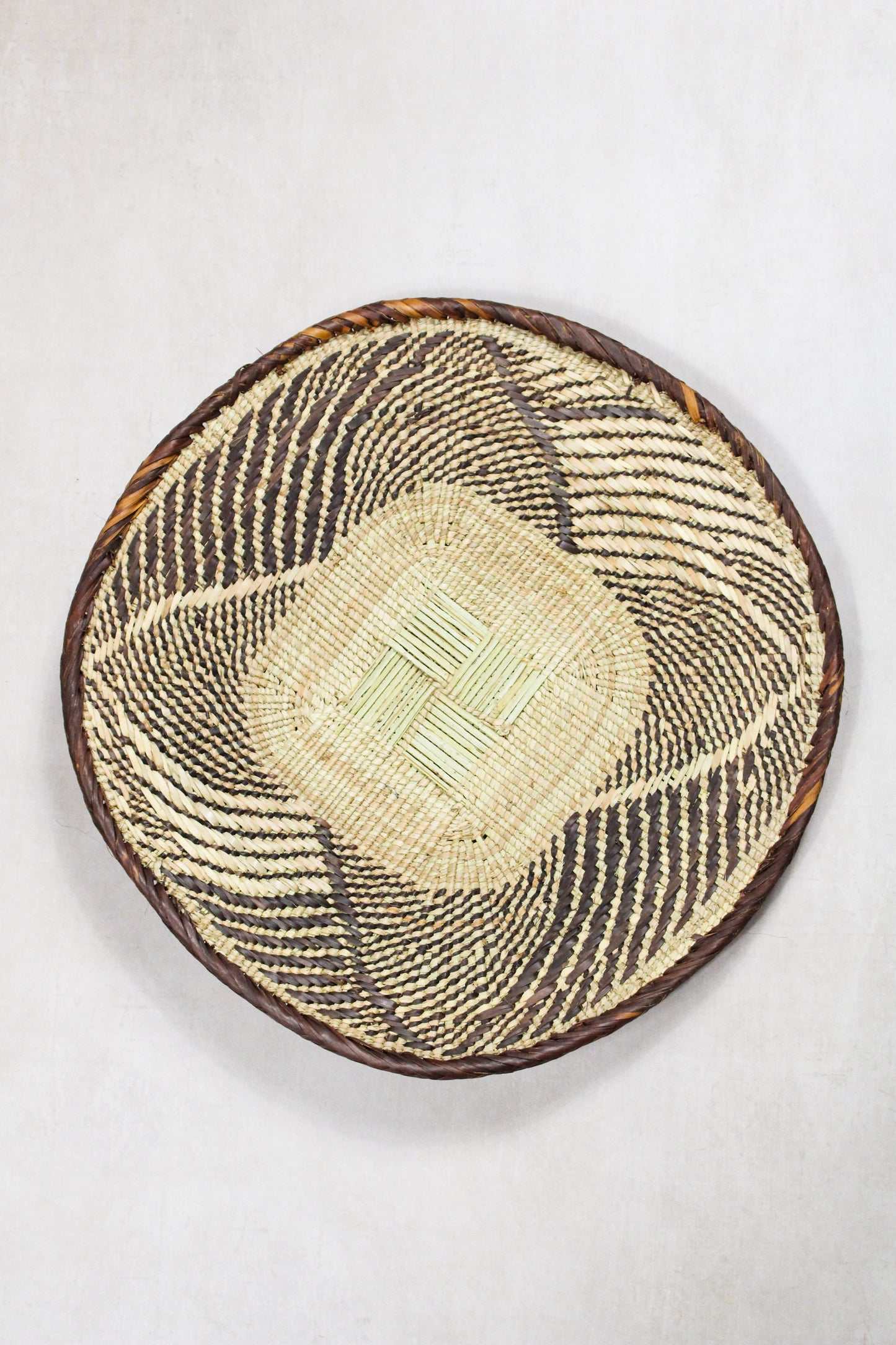Handwoven Tonga wall basket from set No. 80 with naturally dyed geometric woven detailing
