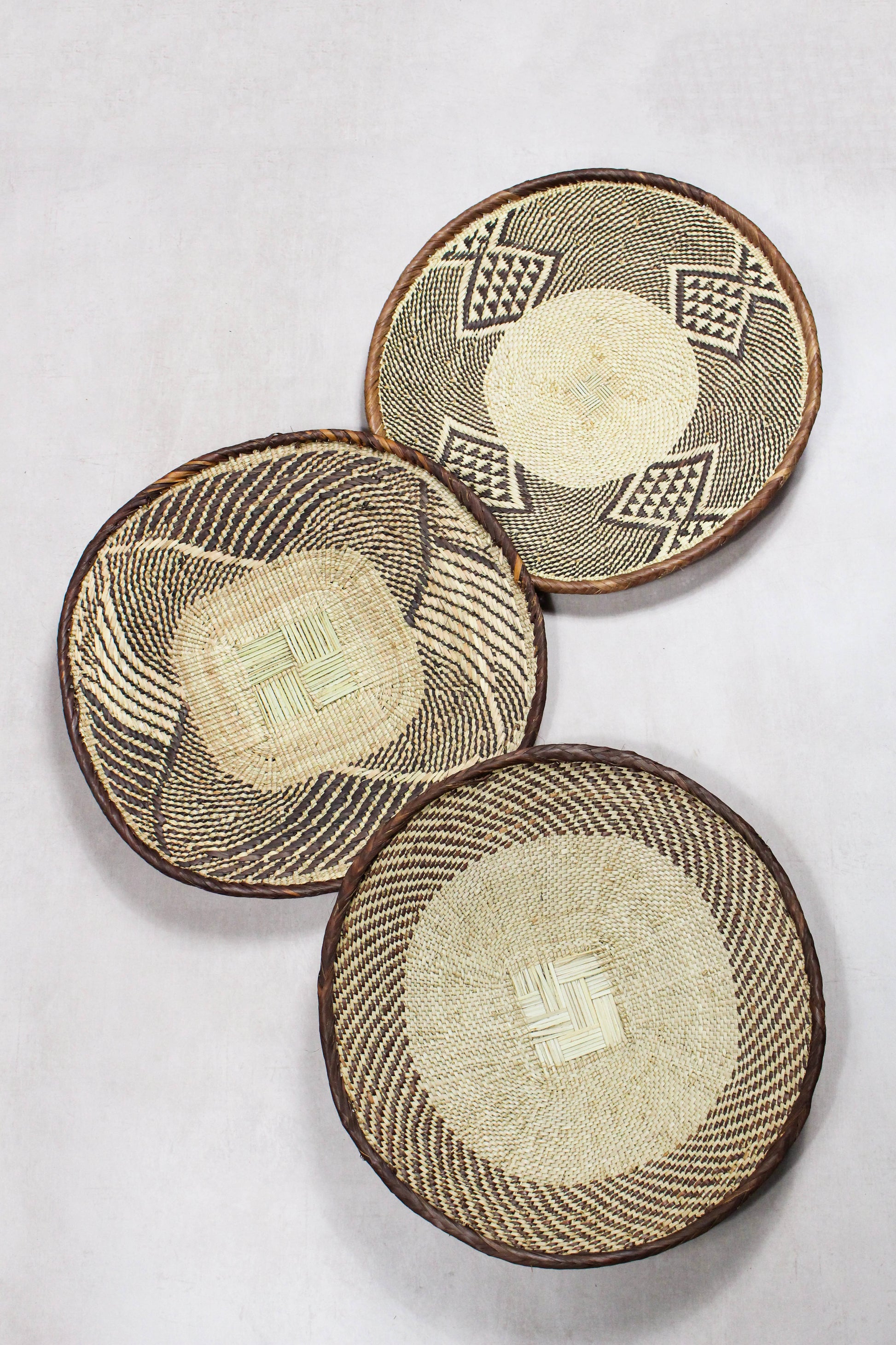 Set of three handwoven Tonga wall baskets No. 80 in naturally dyed Ilala palm
