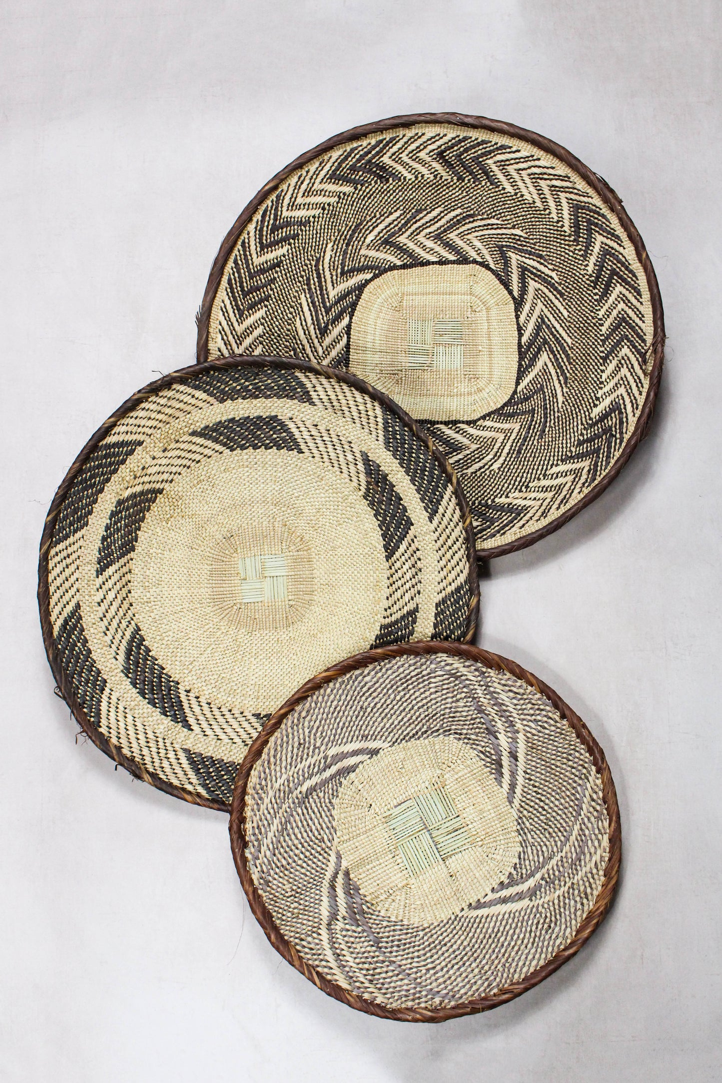 Set of three handwoven Tonga wall baskets No. 90 in naturally dyed Ilala palm