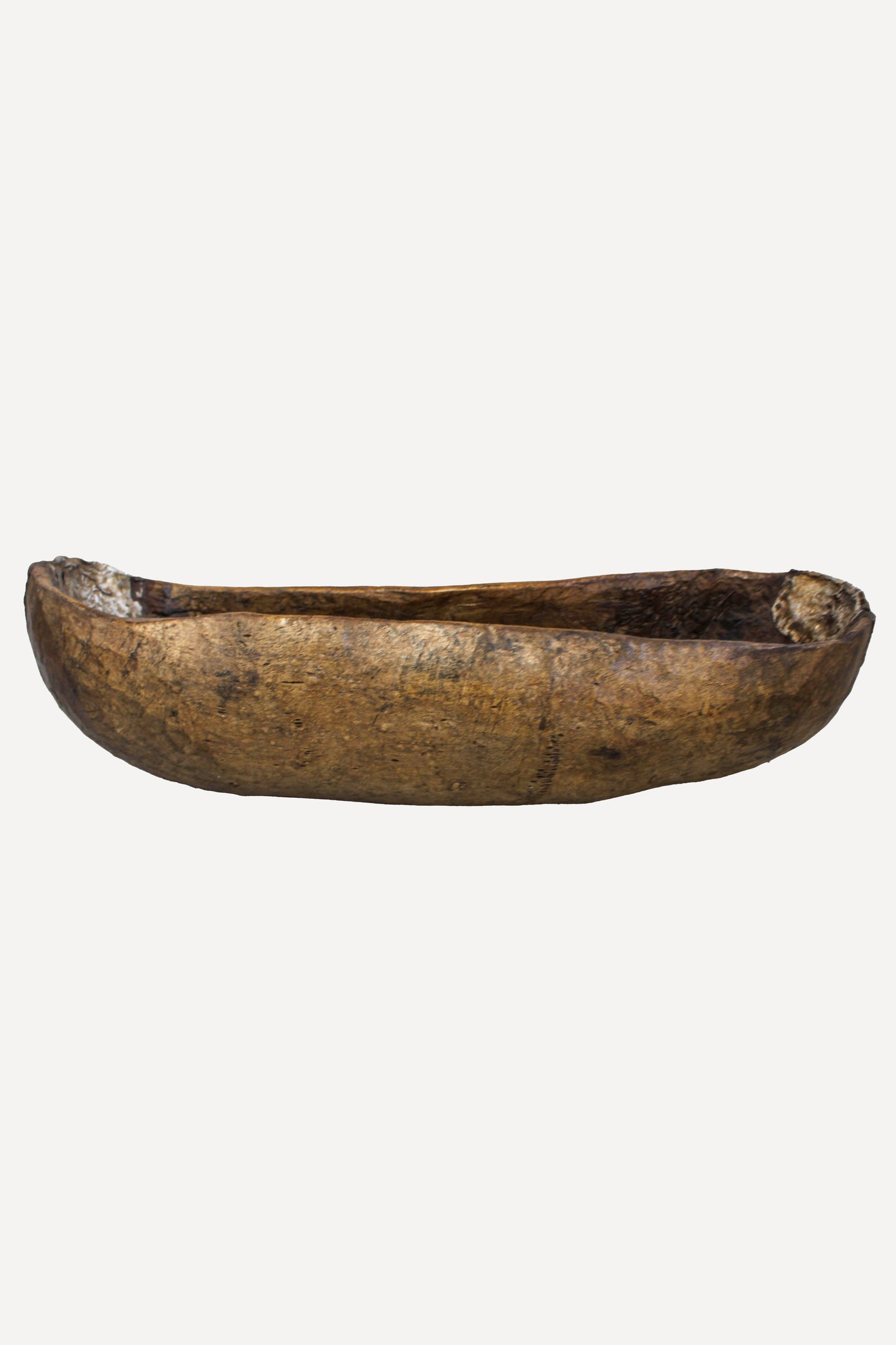 Traditional Rwandan Umuvure vessel 89.1 showing its long hand-carved wooden form
