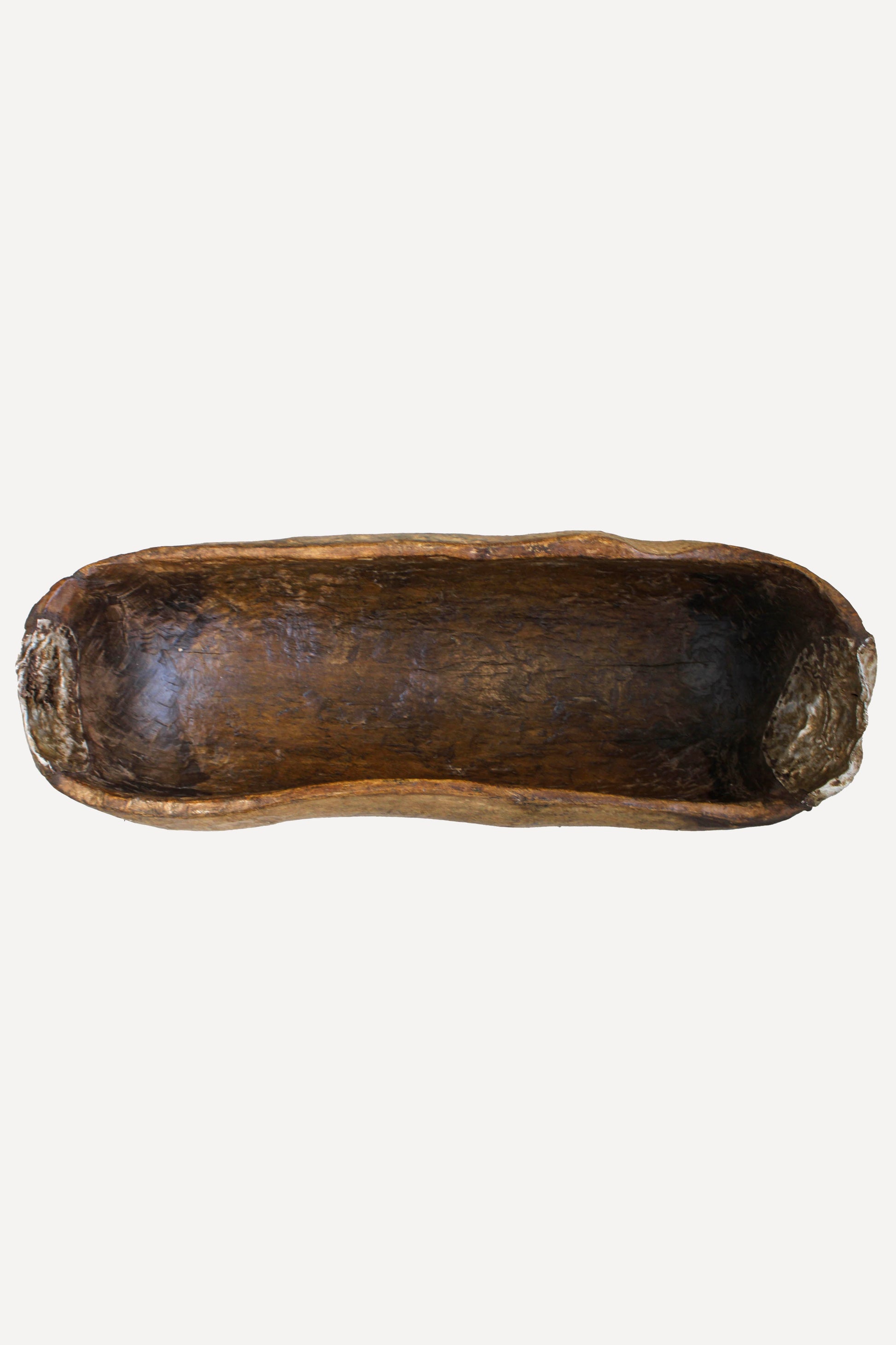 Rwandan Umuvure wooden vessel 89.1 viewed from the side showing its aged surface and carved form
