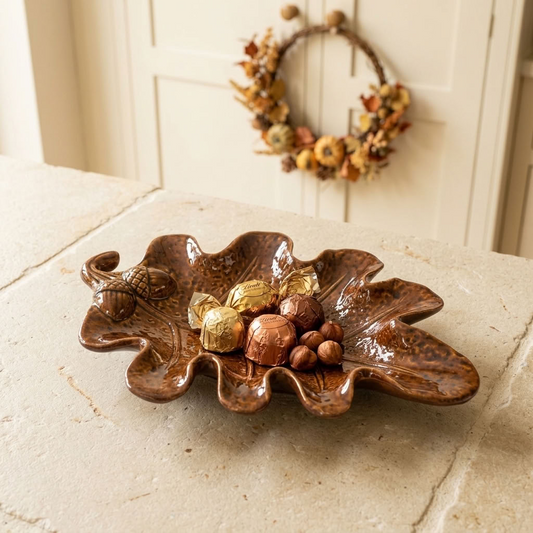 Brown Leaf Trinket Dish styled with seasonal treats on a light wooden worktop in a bright country kitchen