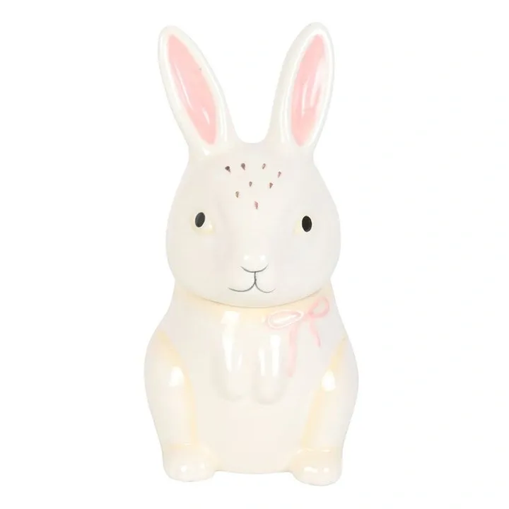 Front view of the bunny shaped ceramic oil burner with pink ears and decorative bow.