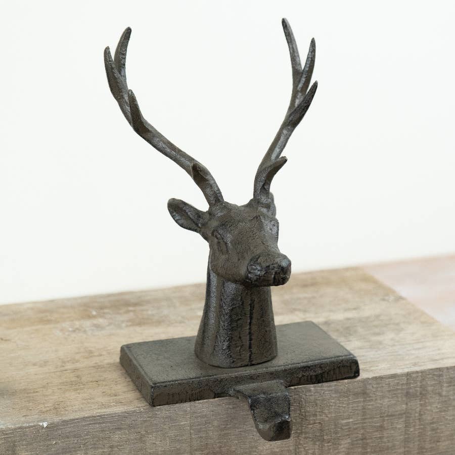 Cast Iron Stag Stocking Holder shown from the side with sturdy base and stocking hook