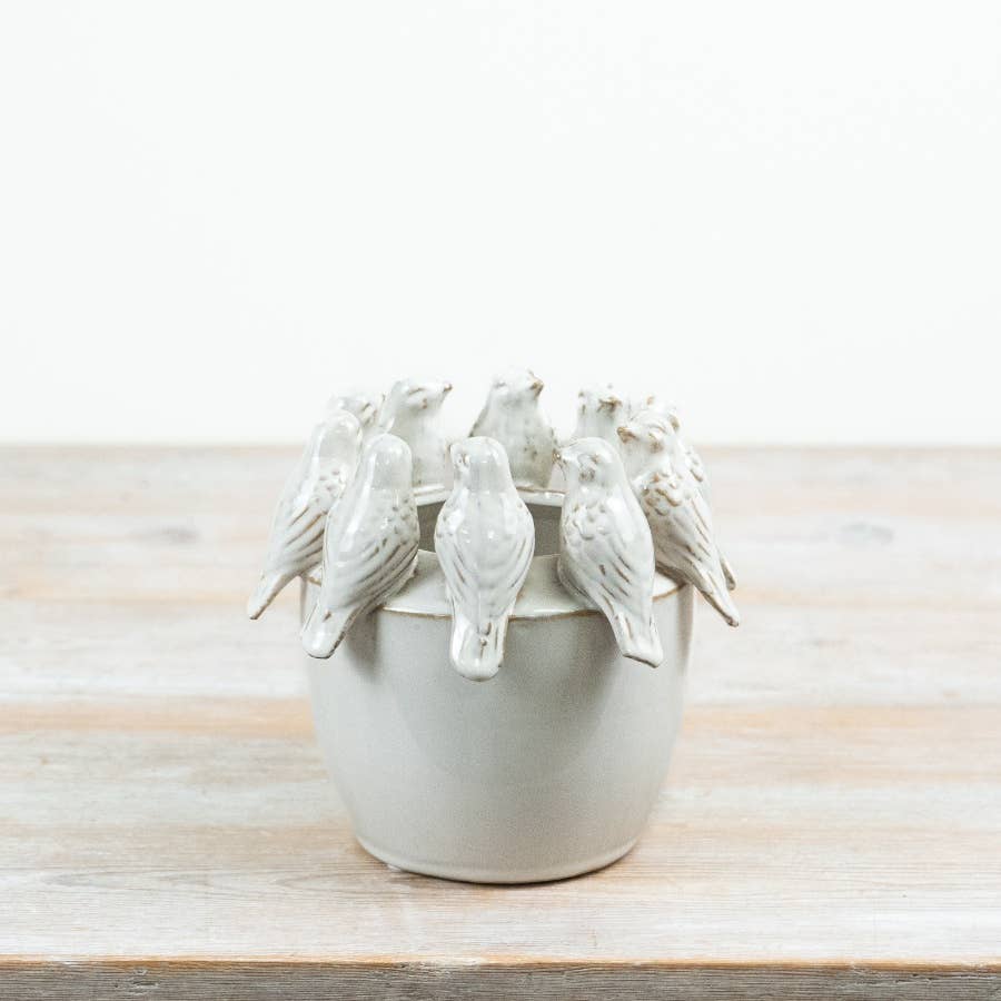 Ceramic planter with sculpted birds perched around the rim, 18.5cm