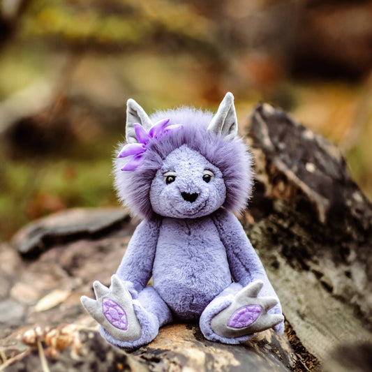 Charlie Bears Amethyst Boo from the Bearhouse collection with fluffy lavender mane and embroidered amethyst gemstone paw pads