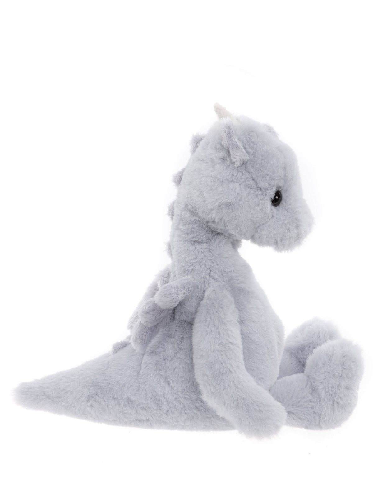 Side view of Charlie Bears Draco Dragon showing cloudy grey plush, wings and tail