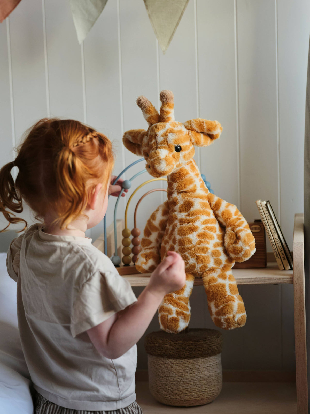 Charlie Bears Gilbert Giraffe plush soft toy during playtime